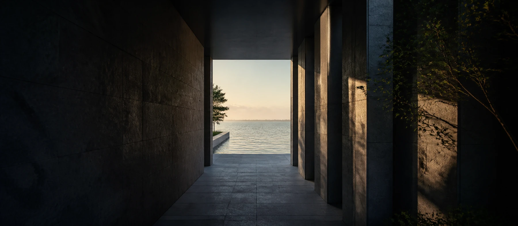 A quiet stone corridor opens toward a calm horizon of water and light.